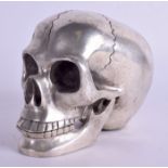 A CONTINENTAL SILVER PLATED SKULL. 11 cm x 9 cm.