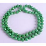 A CHINESE JADEITE NECKLACE. 80 cm long.