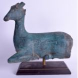 AN EARLY 20TH CENTURY CHINESE CARVED GREEN PAINTED WOOD FIGURE OF A DEER upon an ebonised base. Dee