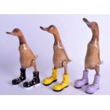 THREE WOODEN DUCKS. 27.5 cm high. (3)