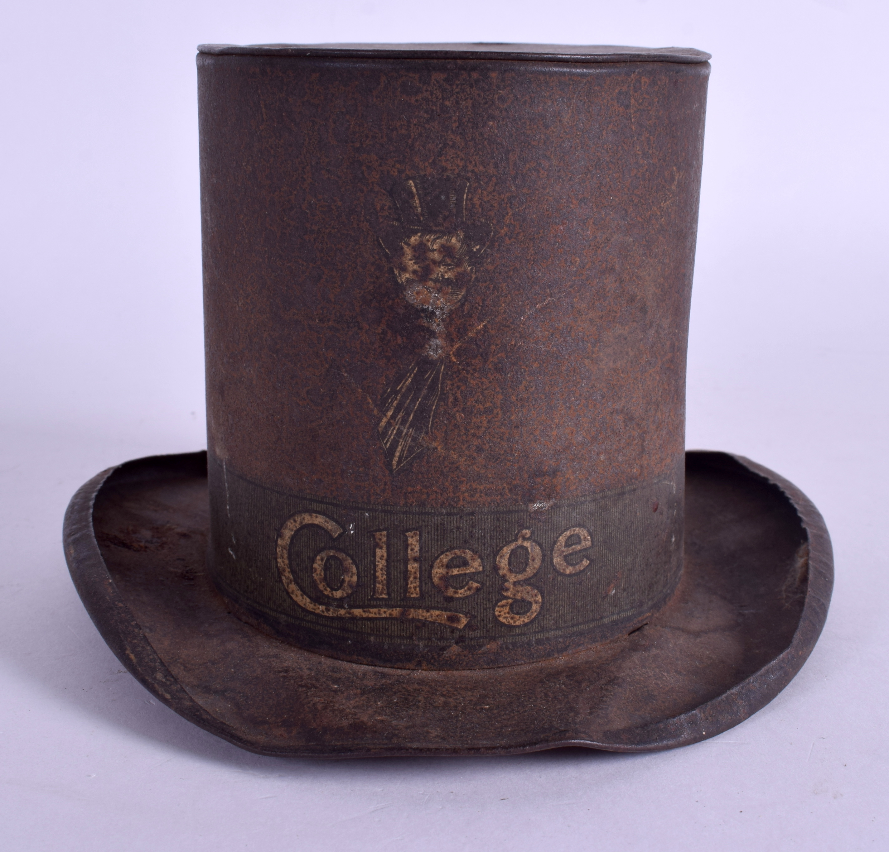 A RARE EDWARDIAN COLLEGE TIN PLATE TOP HAT MONEY BOX. 18 cm wide.