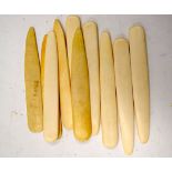 A QUANTITY OF BONE UTENSILS OR MARKERS, possibly for sewing. 12.5 cm. (qty)
