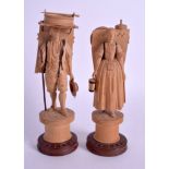 A PAIR OF 1920S SWISS AUSTRIAN BAVARIAN CARVED WOOD FIGURES. 18 cm high.