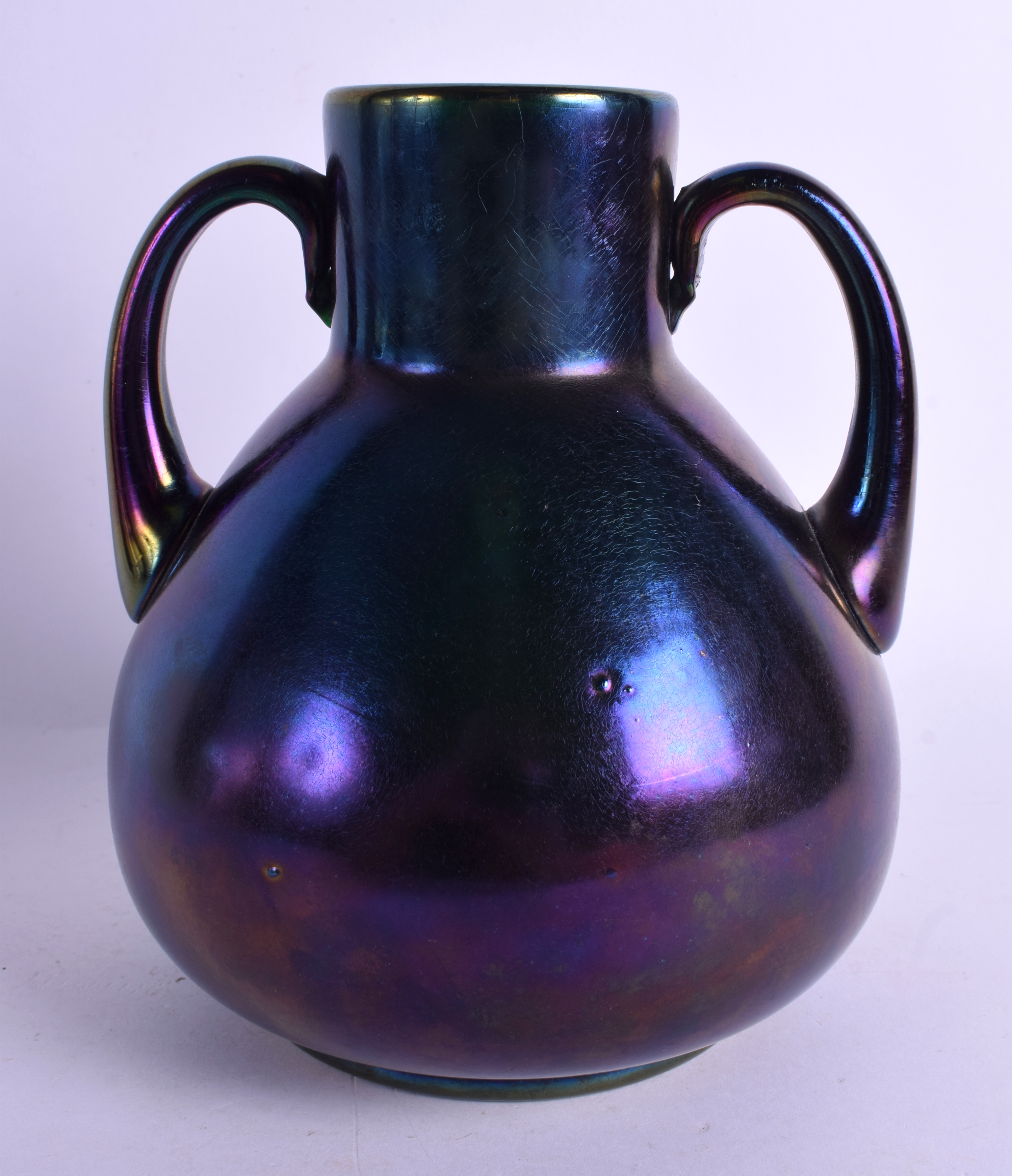 AN ART NOUVEAU AUSTRIAN PURPLE IRIDESCENT GLASS VASE. 20 cm x 15 cm.