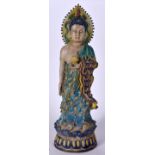 A LARGE CHINESE SANCAI POTTERY BUDDHA, modelled standing holding a lotus flower. 58 cm high.