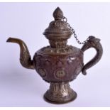 A 19TH CENTURY TIBETAN COPPER AND BRASS MONKS CAP TYPE EWER decorated with motifs and foliage. 23 c