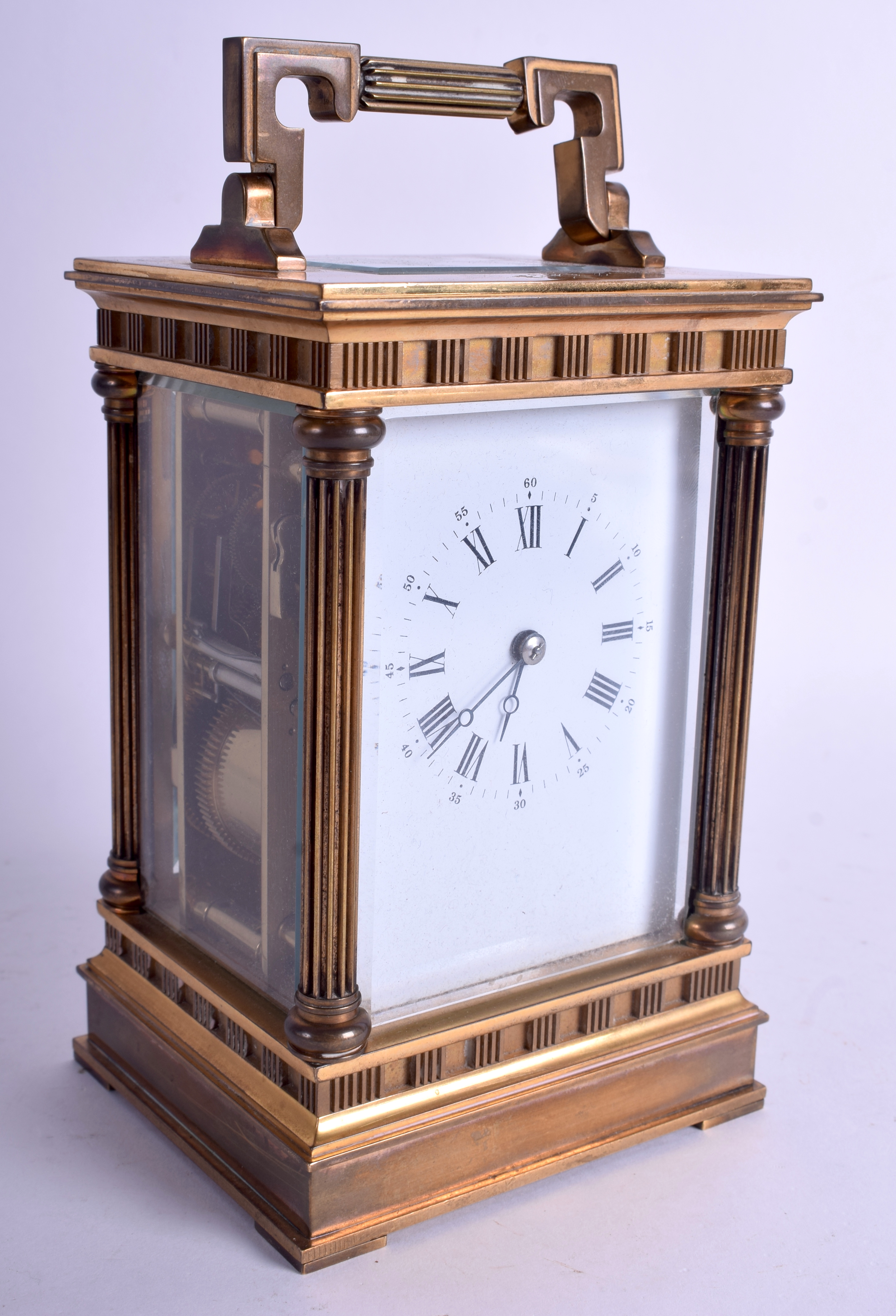 A GOOD FRENCH L'EPPE CARRIAGE CLOCK with classical column supports. 18 cm high inc handle.