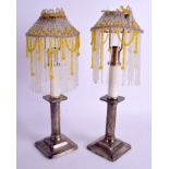 A PAIR OF ANTIQUE STERLING SILVER CANDLESTICKS with lamp fittings. 38 cm high inc fittings.