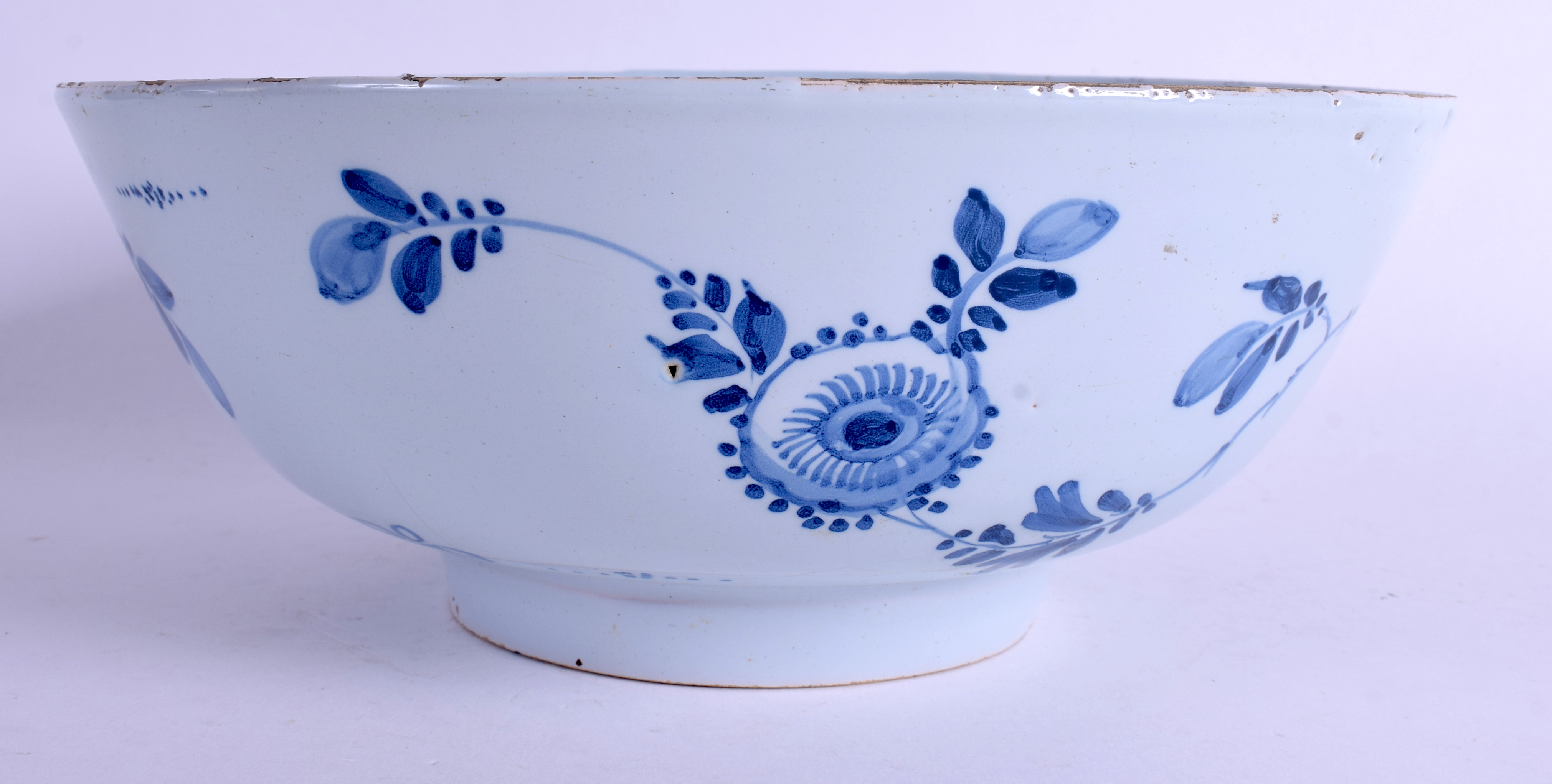 A MID 18TH CENTURY ENGLISH LONDON DELFT CIRCULAR BOWL C1750 painted with flowers and vines. 26.5 cm - Image 2 of 4