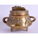 A 19TH CENTURY CHINESE TWIN HANDLED BRONZE CENSER AND COVER decorated with foliage. 12 cm wide.