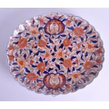 A 19TH CENTURY JAPANESE MEIJI PERIOD SCALLOPED IMARI DISH painted with flowers. 38 cm wide.