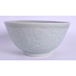 A CHINESE CELADON CIRCULAR PORCELAIN BOWL decorated with fish. 15 cm diameter.