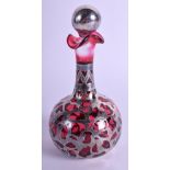 A LATE VICTORIAN/EDWARDIAN CRANBERRY GLASS SCENT BOTTLE overlaid in silver. 13 cm high.
