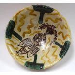 AN ISLAMIC PERSIAN POTTERY BOWL, painted with symbols.21.75 cm wide.