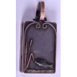 A LATE VICTORIAN SILVER AND ROSE GOLD FISHERMAN'S LOCKET decorated with a swimming salmon. 2.75 cm