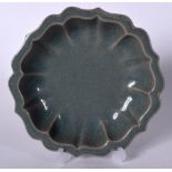 A CHINESE CELADON GLAZED PORCELAIN DISH, lobed in form. 19.5 cm wide.