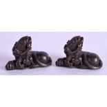A PAIR OF 19TH CENTURY CHINESE BRONZE SCROLL WEIGHTS in the form of a beast. 5 cm x 1.5 cm.