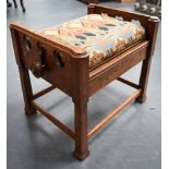 A GOOD ARTS & CRAFTS OAK LIBERTY STOOL, formed with a floral upholstered seat, fitted with a Brooks