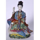AN EARLY 19TH CENTURY CHINESE FAMILLE ROSE FIGURE OF GUANYIN modeled riding upon a bird. 29 cm x 15