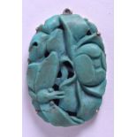 A 19TH CENTURY CHINESE CARVED TURQUOISE SILVER PENDANT of naturalistic form. Turquoise 2.25 cm x 3.