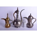 THREE ANTIQUE MIDDLE EASTERN TURKISH BRONZE STEEL EWERS in various forms. Largest 42 cm x 21 cm. (3