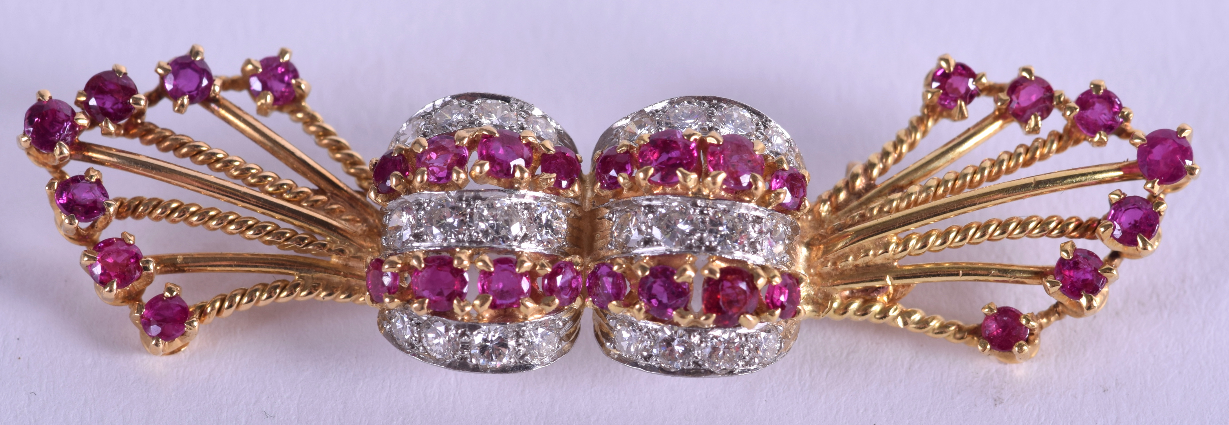 A FINE 1970S 18CT GOLD RUBY AND DIAMOND BROOCH. 8.6 grams. 5.5 cm wide.