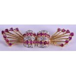 A FINE 1970S 18CT GOLD RUBY AND DIAMOND BROOCH. 8.6 grams. 5.5 cm wide.