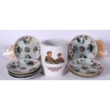 A CHINESE CULTURAL REVOLUTION STYLE PORCELAIN BRUSH POT, together with eight famille rose saucers a