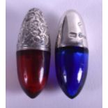 A NEAR PAIR OF 19TH CENTURY RUBY AND BRISTOL BLUE SCENT BOTTLES decorated with foliage. 4 cm long.