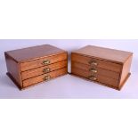 A PAIR OF 1930S OAK THREE DRAWER JEWELLERY CHESTS with shell handles. 30 cm x 21 cm x 15 cm.