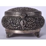 A PERSIAN OR ISLAMIC WHITE METAL BOX, decorated in relief with extensive foliage. 22 cm wide.