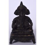 AN INDIAN BRONZE STATUE IN THE FORM OF GANESHA, modelled holding ritual objects upon a rectangular