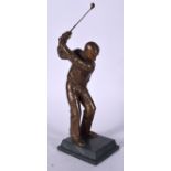 A BRONZE FIGURE OF A STANDING GOLFER, modelled upon a stepped plinth. 48 cm high.