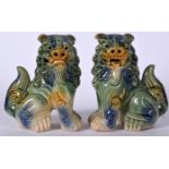 A PAIR OF CHINESE GREEN GLAZED PORCELAIN DOGS OF FOE OR FOO DOG, formed in imposing stance. 15 cm h