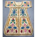 A RARE ISLAMIC OTTOMAN TALISMANIC SHIRT, painted with extensive script in panels. 104 cm x 86 cm.