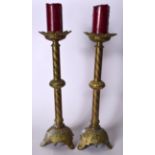 A LARGE PAIR OF ANTIQUE FRENCH BRASS ALTER CANDLESTICKS, formed with a flattened knop and decorated