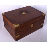 AN ANTIQUE MILITARY CAMPAIGN WOODEN WRITING SLOPE BOX, formed with brass cartouche and escutcheon.