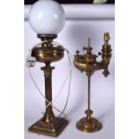 A RARE STUDENT GENIE LAMP, together with another brass lamp. Largest 68 cm to top.