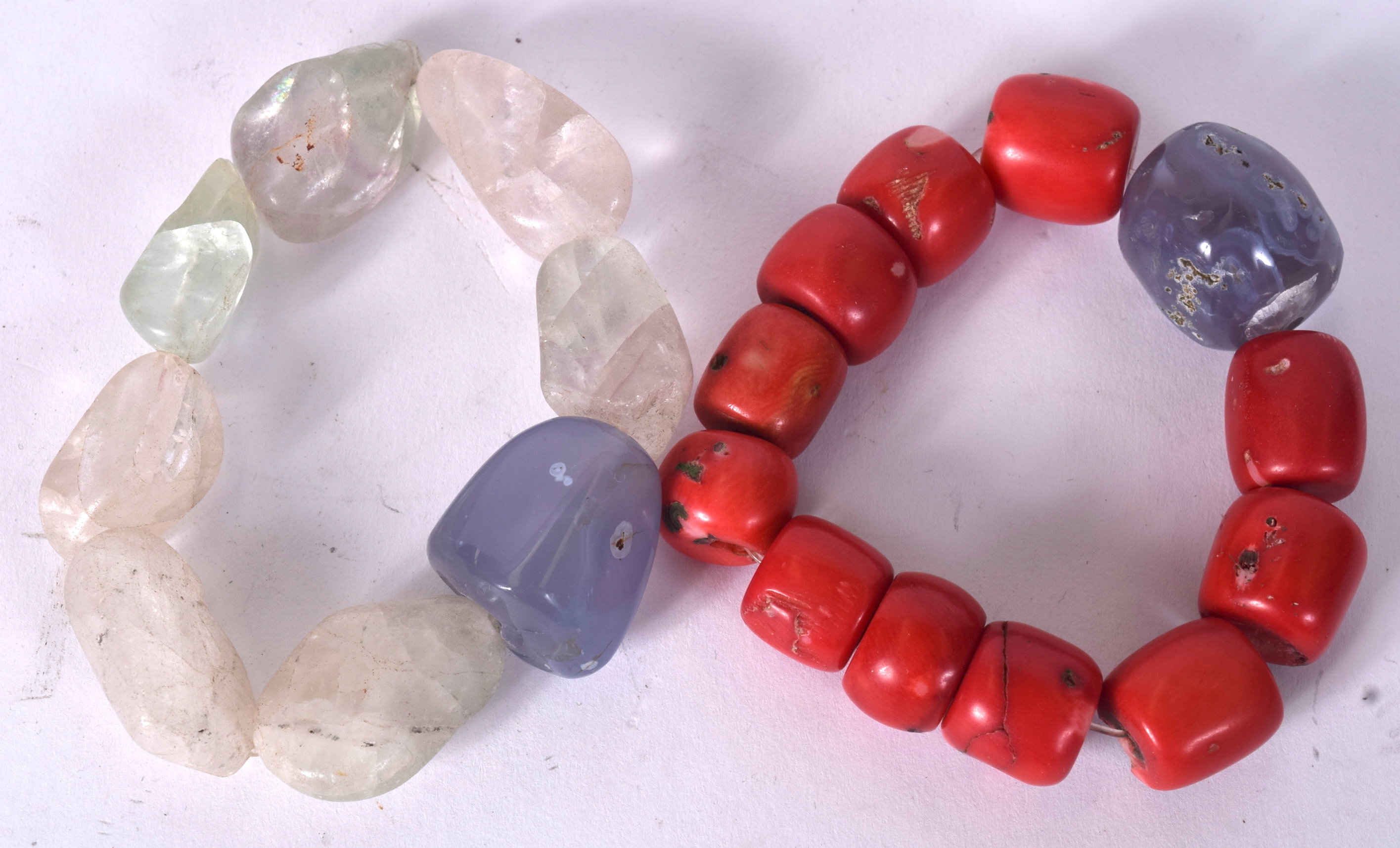 A RED CORAL BRACELET, together with a fluorite example. (2)