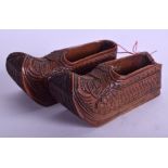 A PAIR OF 19TH CENTURY CONTINENTAL FRUITWOOD CLOGS carved with motifs. 8 cm long.