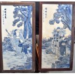 A LARGE PAIR OF CHINESE BLUE AND WHITE PORCELAIN FRAMED PANELS, depicting figures in landscapes. 79