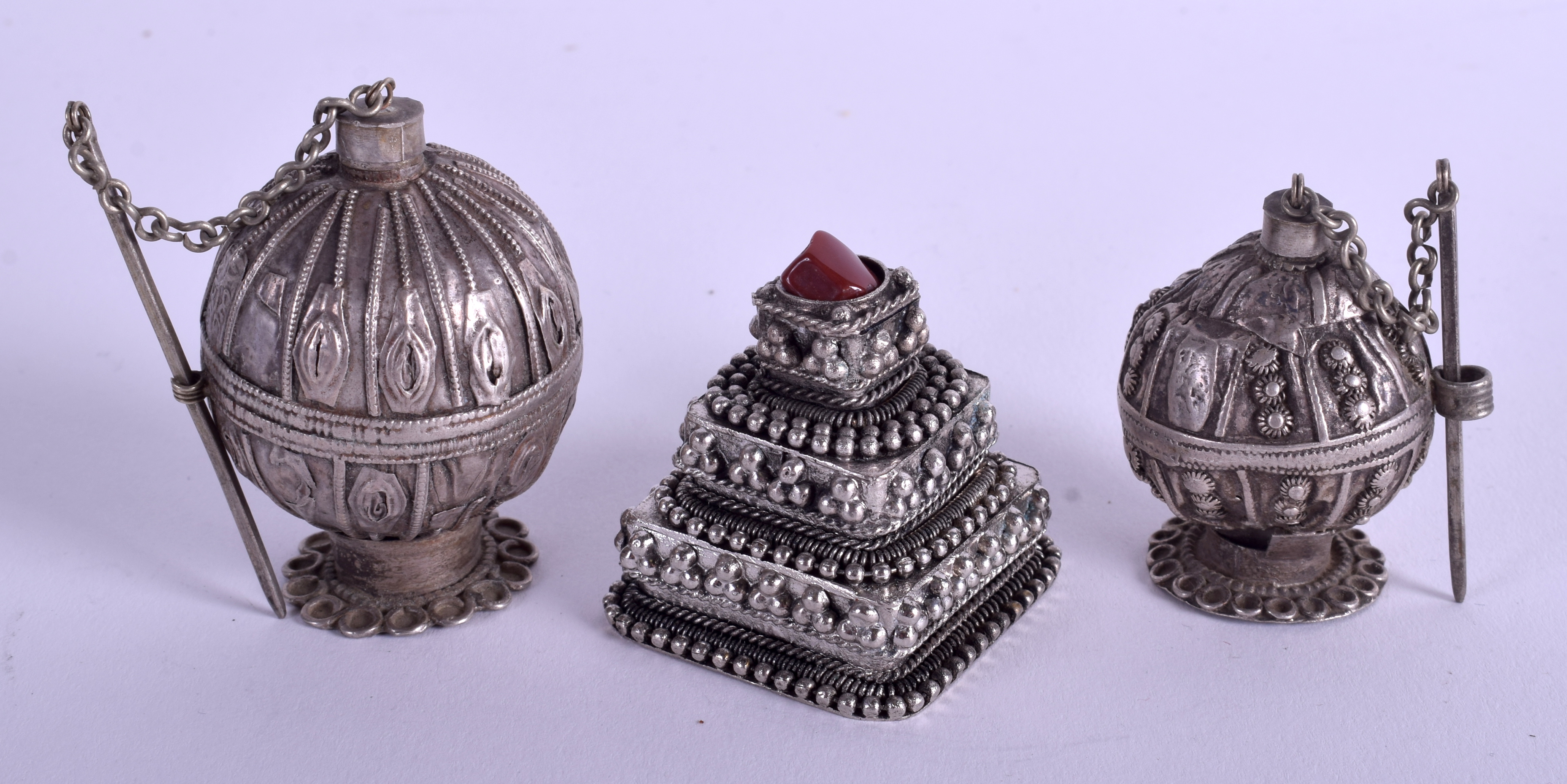 THREE EARLY 20TH CENTURY MIDDLE EASTERN SILVER BOXES in various forms. 3.2 oz. (3) - Image 2 of 2