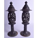 A PAIR OF CHINESE ASIAN EASTERN BRONZE LANTERNS decorated with foliage. 41 cm high.