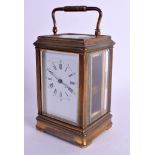 AN ANTIQUE FRENCH BRASS CARRIAGE CLOCK with roman numeral & numerical dial. 17.5 cm high inc handle