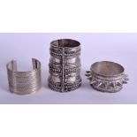 THREE MIDDLE EASTERN TRIBAL SILVER BRACELETS in various forms. 12.8 oz. Largest 9 cm long. (3)