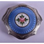 A 1920S SILVER AND ENAMEL PURSE FORM COMPACT painted with flowers. 6 cm wide.