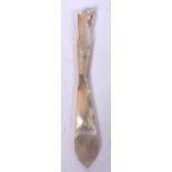 AN 19TH CENTURY MOTHER OF PEARL PAPER KNIFE WITH HORSE HEAD HANDLE, incised “1865”. 22 cm long.