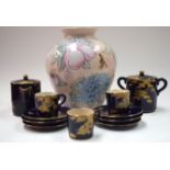 A BLUE GROUND JAPANESE SATSUMA PART TEA SET, together with a vase decorated with fruit. Vase 23 cm