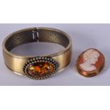 AN ANTIQUE GOLD CAMEO BROOCH together with a bangle. (2)