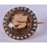AN ANTIQUE PEARL AND TOPAZ BROOCH. 1.5 cm wide.